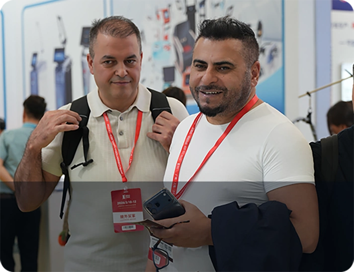 Professional partners discussing equipment at an exhibition